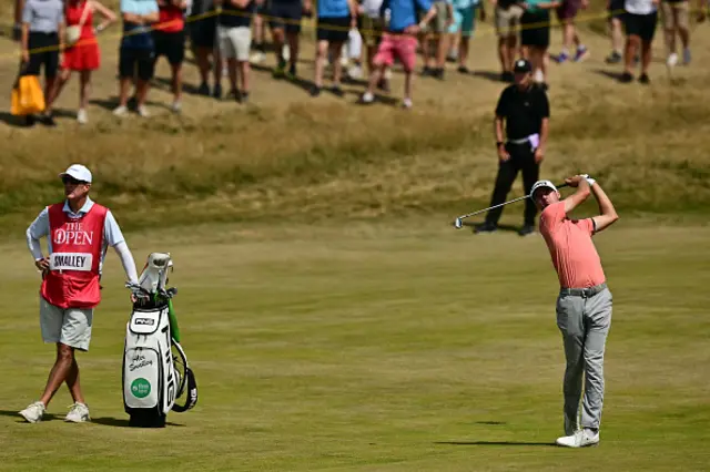 US golfer Alex Smalley watches his approach shot