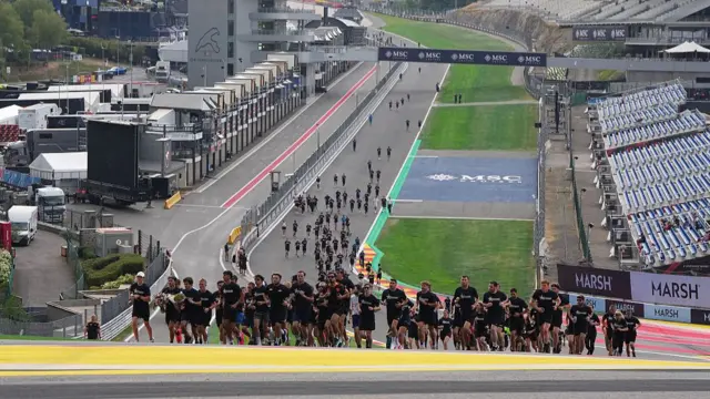drivers and teams jog around the Spa Circuit