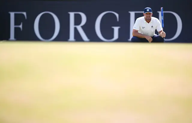 Bryson DeChambeau of the United States lines up a putt