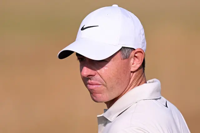 Rory McIlroy looks on