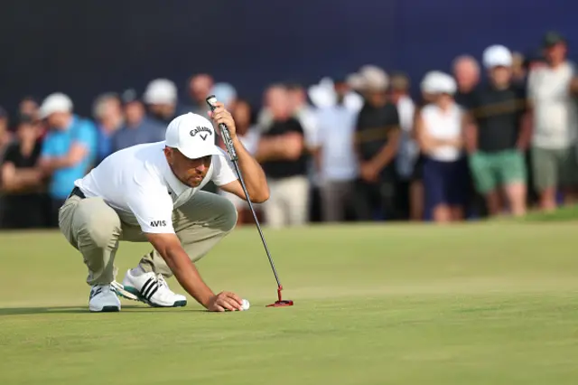 Xander Schauffele of the United States lines up a putt