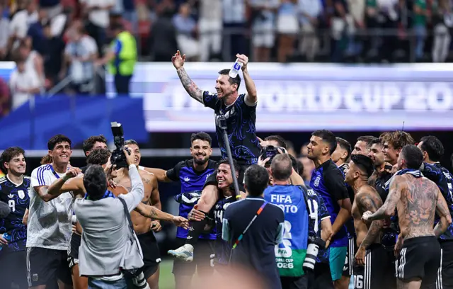 Lionel Messi lifted on to team-mates shoulders