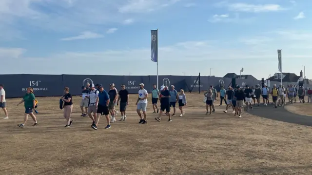 Fans arrive at the Open