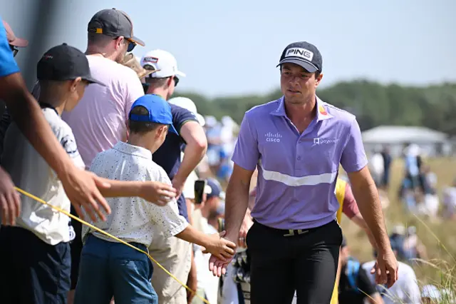 Viktor Hovland of Norway walks to tee off