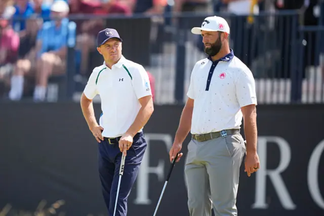 Jordan Spieth and Jon Rahm of Spain on the green