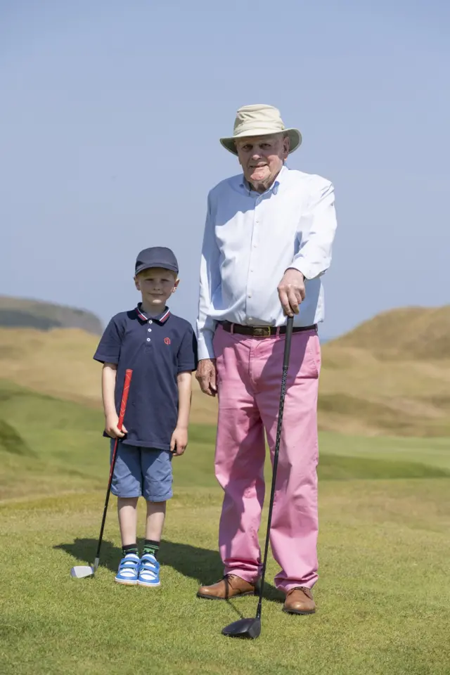Derek Kingsbury, celebrating his 100th birthday by playing golf with six-year-old Louis Westlake at St Enodoc in Cornwall