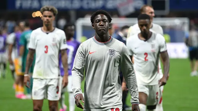 Kobbie Mainoo #16 of England reacts after the 1-2 loss during the FIFA World Cup 2026 Semi Final match between England and Argentina at Atlanta Stadium on July 15, 2026 in Atlanta, Georgia