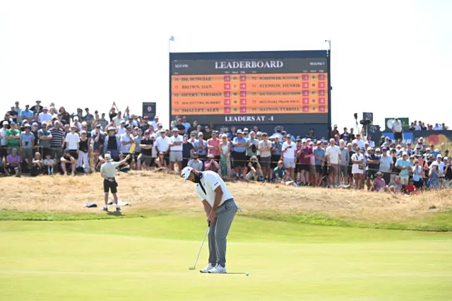 Jon Rahm of Spain putts on the eighth green
