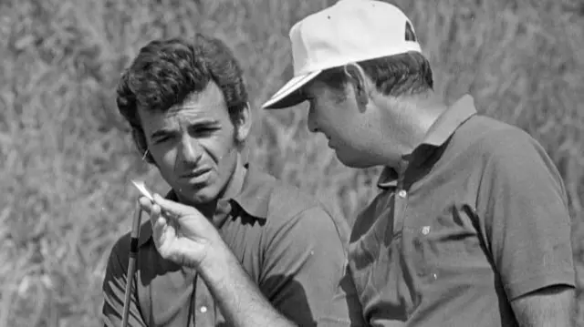Royal Birkdale Golf Club in Southport, England, held 7th - 10th July 1971. Pictured, Charles Coody inspects Tony Jacklin clubs.