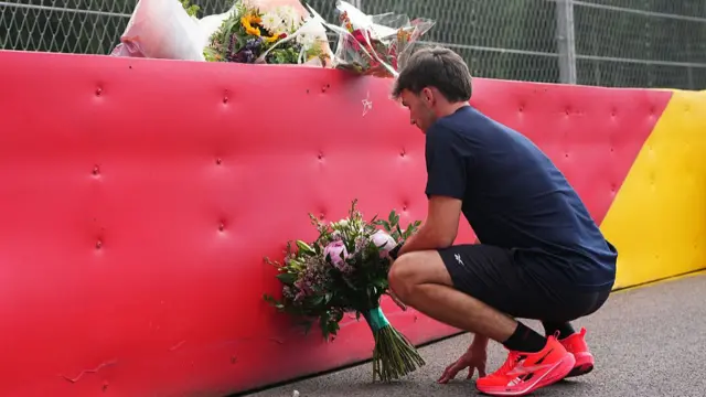 Pierre Gasly lays flowers on the Spa Circuit