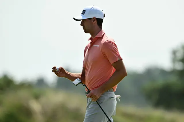 US golfer Alex Smalley reacts to making a birdie putt