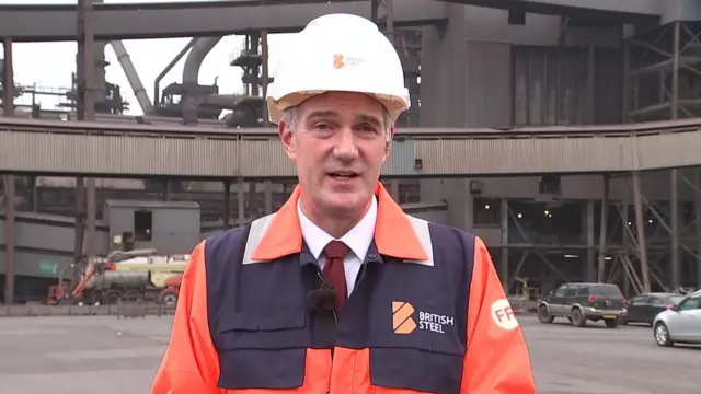 UK cabinet minister Peter Kyle speaks to BBC Breakfast - he is wearing a high-vis jacket and helmet saying "British Steel"