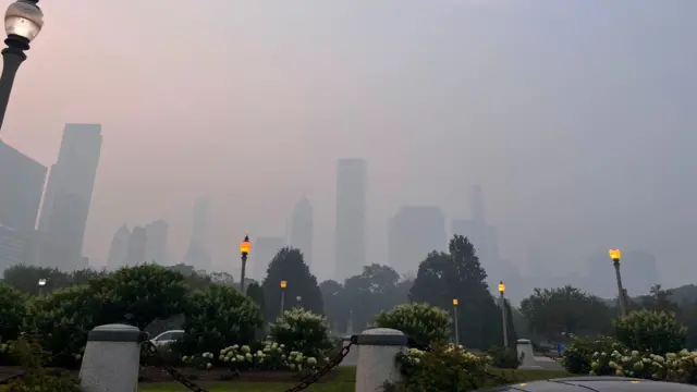 Wildfire smoke obscures high-rise buildings in Chicago