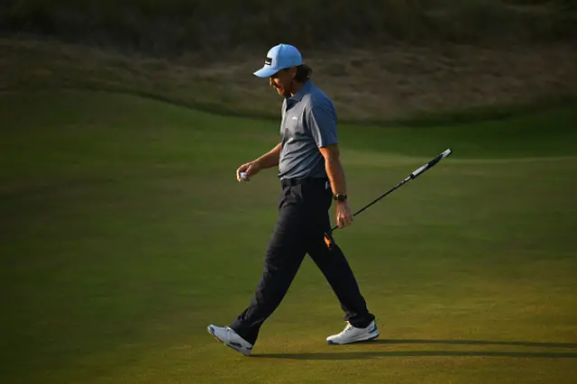 Tommy Fleetwood of England walks on