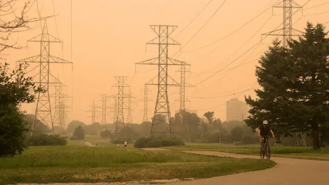 Orange haze from wildfire smoke is seen in Toronto, Ontario, Canada, on July 15, 2026.