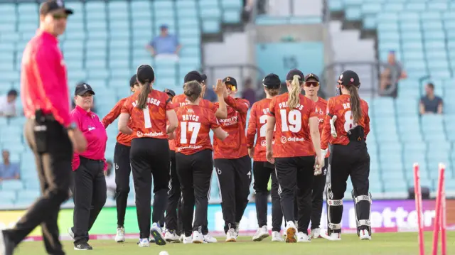 The Blaze celebrate wicket of Heather Graham