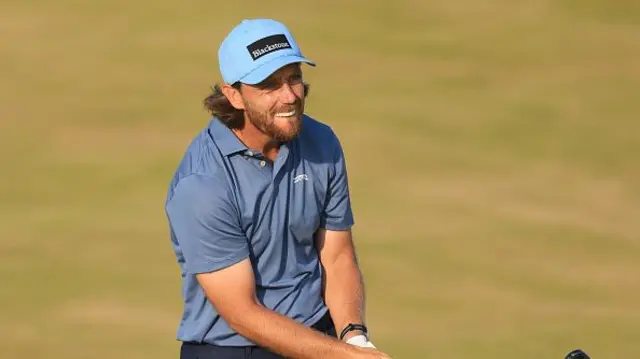 Tommy Fleetwood of England hits his second shot