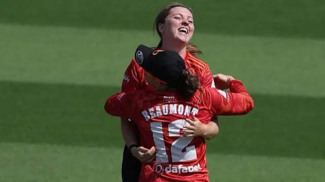 Grace Ballinger and Tammy Beaumont celebrate Danni Wyatt-Hodge's wicket