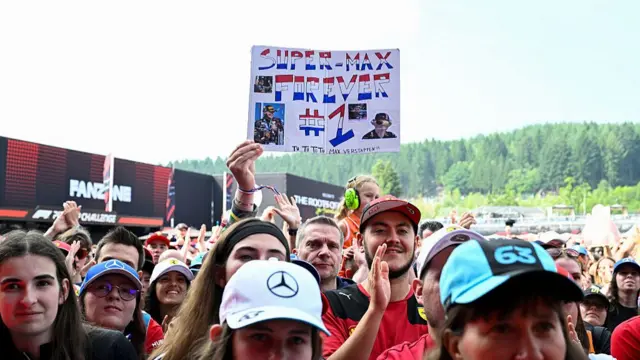 fan holds up a Max Verstappen sign