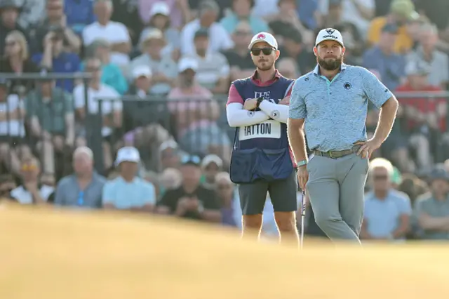 Tyrrell Hatton of England lines up a putt