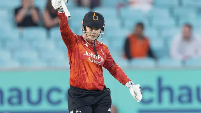 Tammy Beaumont celebrates scoring fifty