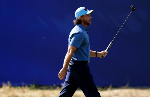 Tommy Fleetwood of England celebrates putting