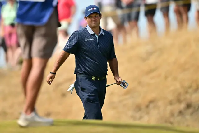 Patrick Reed walks