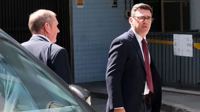 Burnham gets out of his car