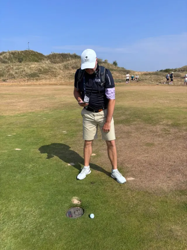 Graeme Storm assessing a golf ball at Birkdale