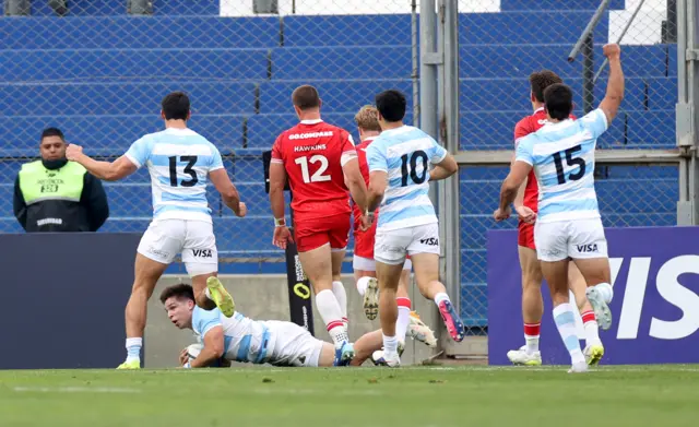 Justo Piccardo of Argentina scores a try against Wales