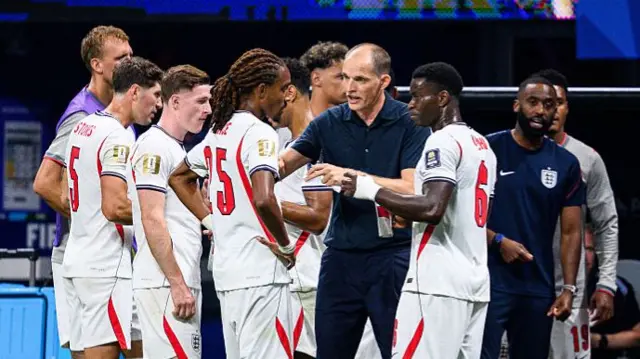 Thomas Tuchel gives the England players instruction during a hydration break in their semi-final defeat to Argentina