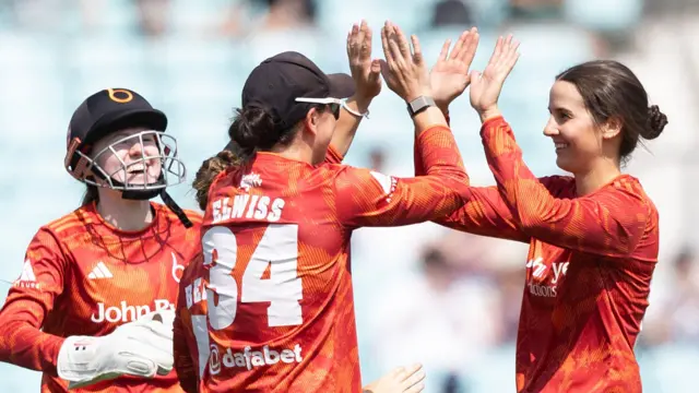 George Elwiss and Charli Knott celebrate