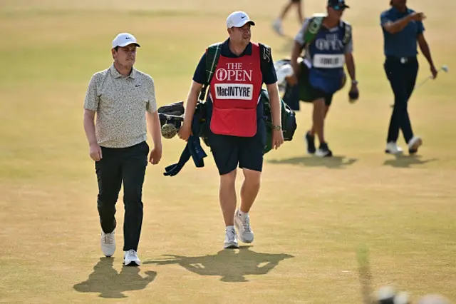 Scotland's Robert MacIntyre and his caddie Mike Burrows walk to the 18th green