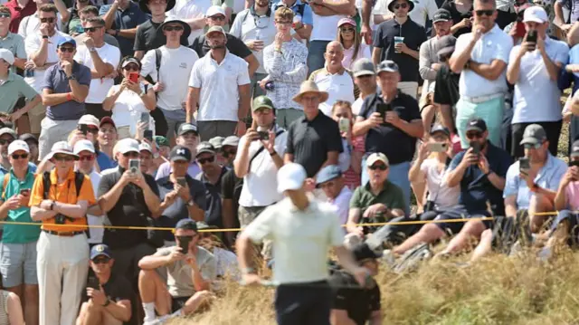 Fans watch Rory McIlroy on the first hole at Royal Birkdale in Round One