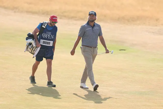 Daniel Brown of England and caddie Jonathan Bell