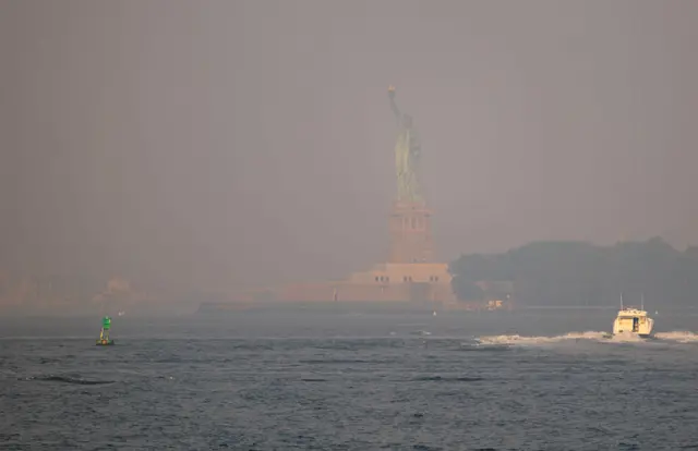 The Statue of Liberty as seen through a hazy sky.