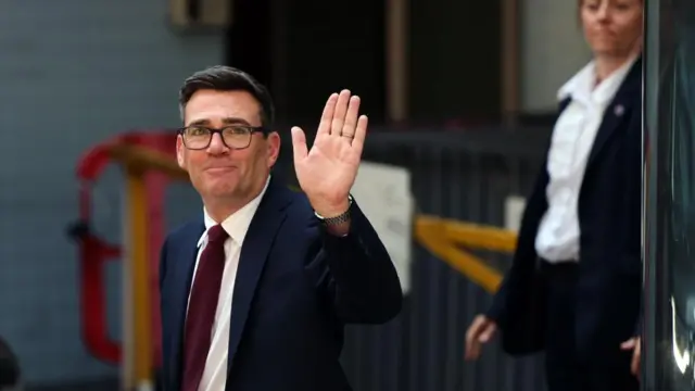 Andy Burnham waving as he leaves Labour's special conference on Friday