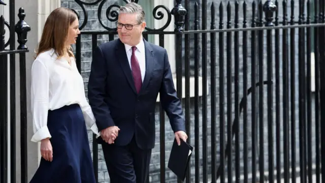 Keir Starmer holding hands with his wife Victoria outside 10 Downing Street