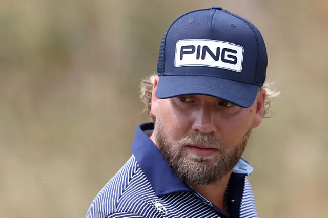 Daniel Brown of England looks across the first hole