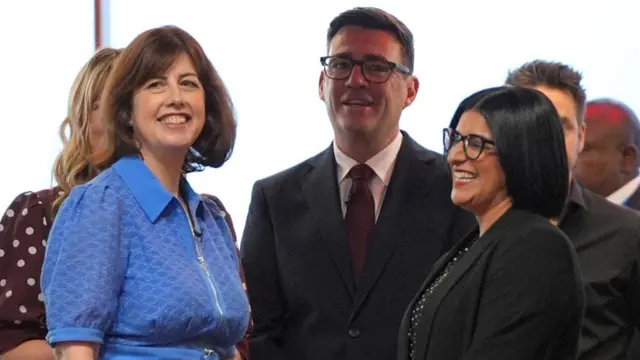 Lucy Powell, Andy Burnham and Shabana Mahmood smiling together at the conference