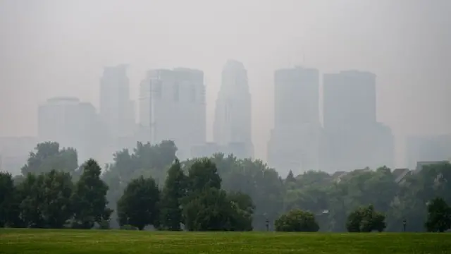 The skyline of St Paul Minnesota is hazy with smoke