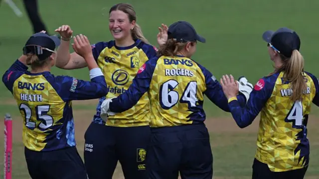Trudy Johnson celebrates her wicket