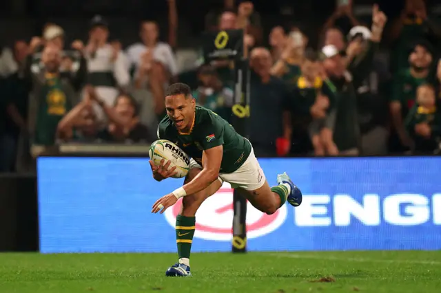 Herschel Jantjies of South Africa dives in to score his team's fifth try