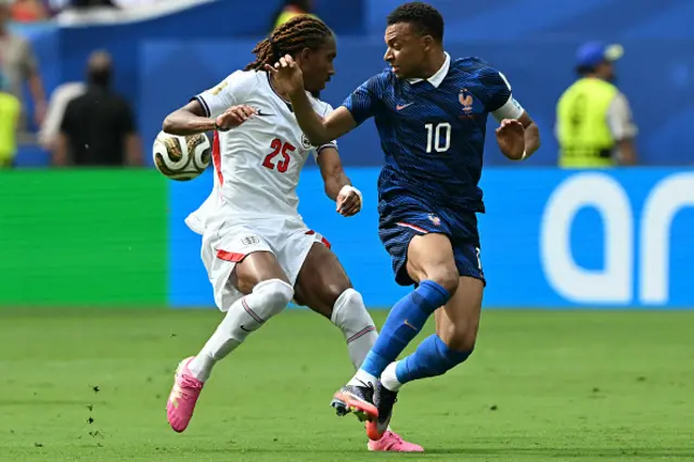 Djed Spence and France's forward #10 Kylian Mbappe fight for the ball