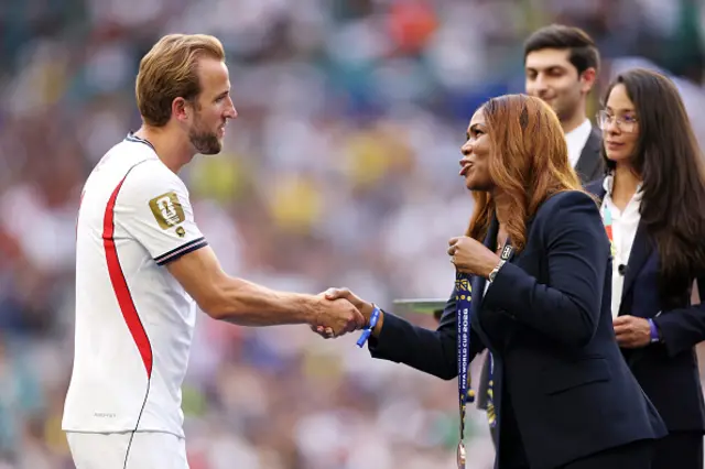 Harry Kane #9 of England receives the third place medal