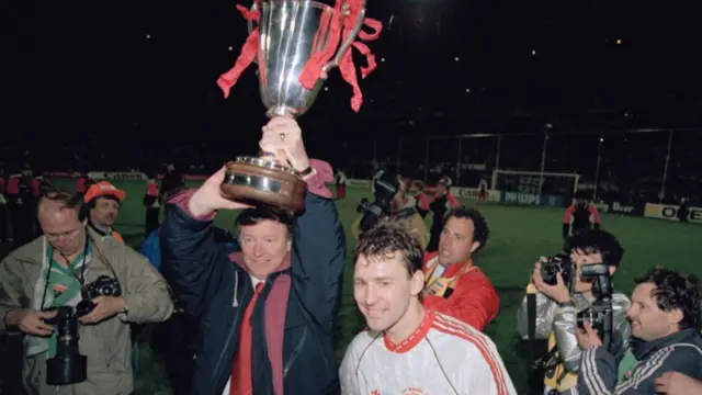 Alex Ferguson holds aloft the Cup Winners Cup trophy alongside Bryan Robson