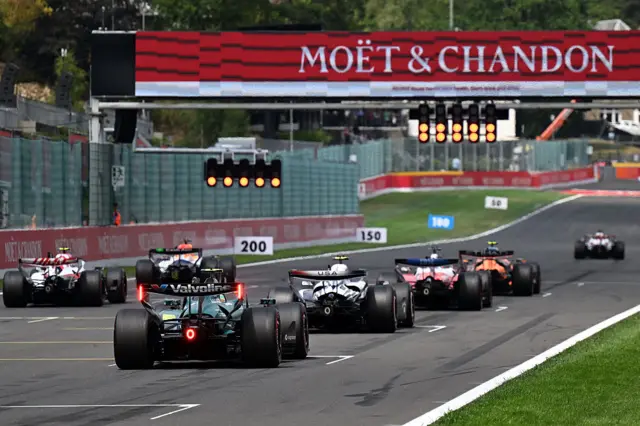Cars line up for a practice start at Spa