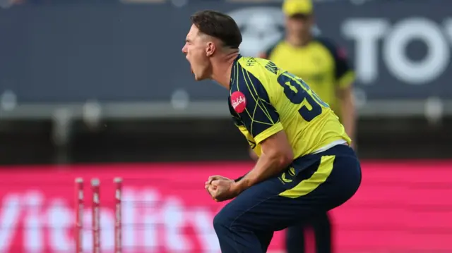 Sonny Baker celebrates taking a wicket