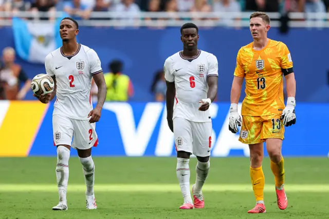 Ezri Konsa #2, Marc Guehi #6 and Dean Henderson #13 of England react