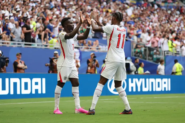 Bukayo Saka #7 of England celebrates with Marcus Rashford